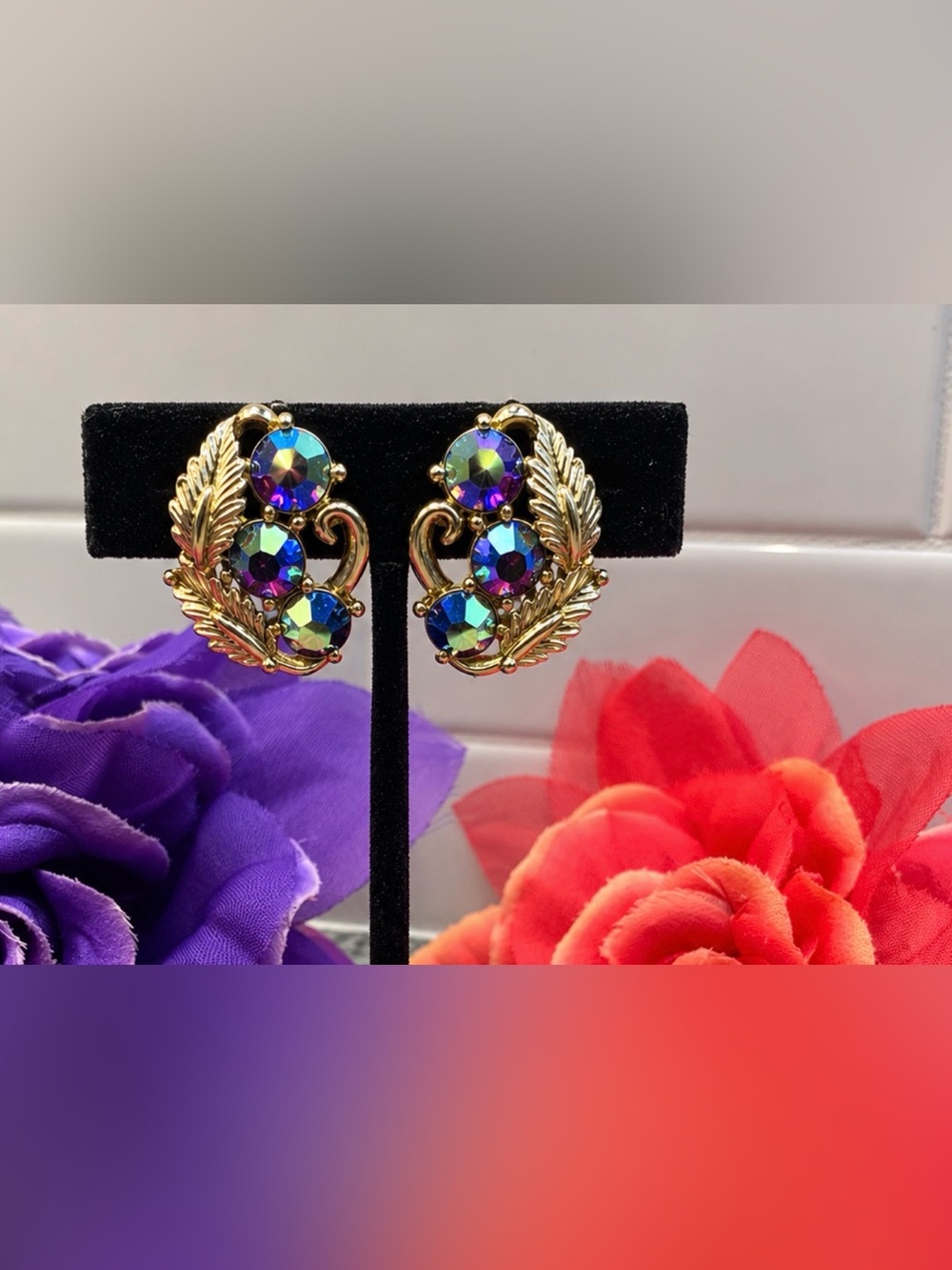 Vintage D&E Juliana earrings, purple auroura borealis stones, gold clips.